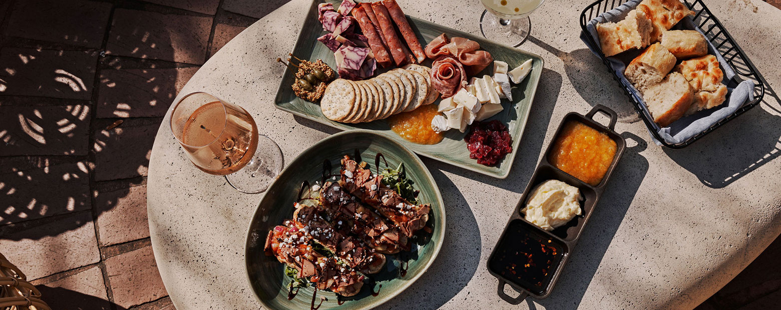 charcuterie board and other appetizers on a table